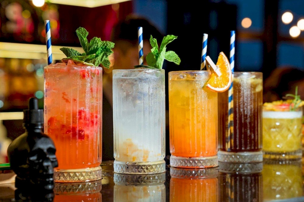 The perfect blend of city lights and signature cocktails awaits you at Sky 21 Bar & Bistro